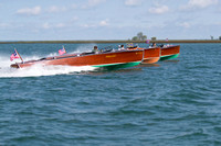 Three wooden speedboats